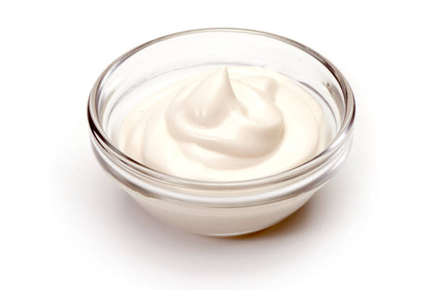 istock Bowl of sour cream on white background 864433356