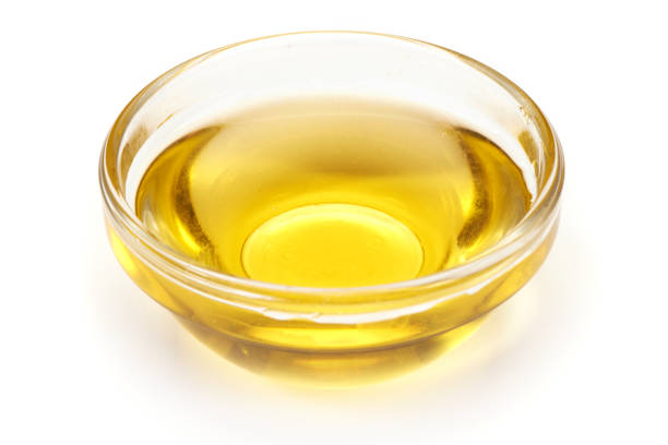 istock cooking vegetable oil in a small, glass cup, isolated on white background 864433548
