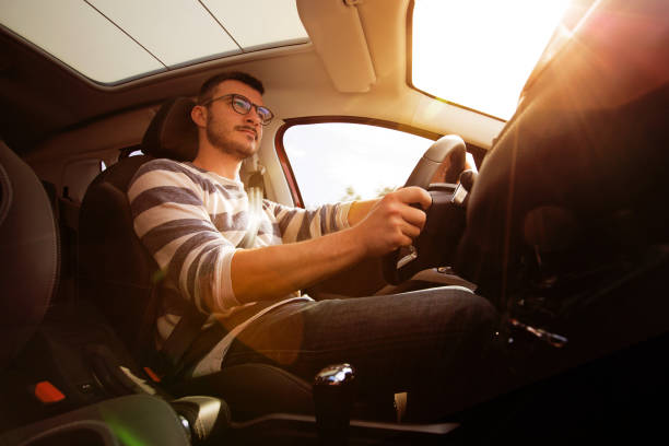 istock Casual Man driving in the car 864434486
