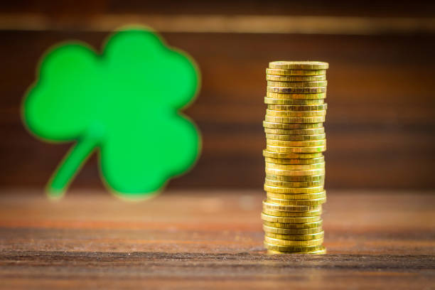istock Coins stacked, clover leaves. St.Patrick 's Day. 864434814