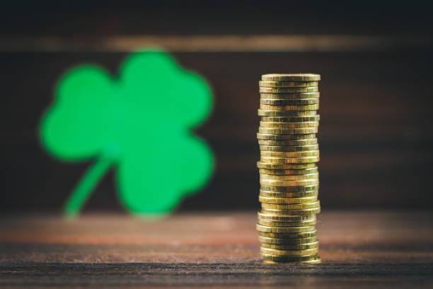 istock Coins stacked, clover leaves. St.Patrick 's Day. 864434838