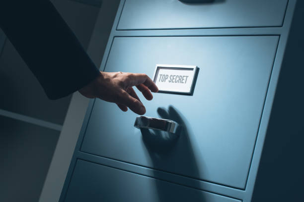 istock Office worker searching confidential information 864435058
