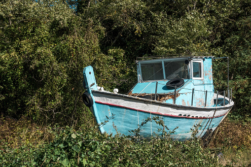 Abandoned boat in forest, Halkidiki, Greece.
