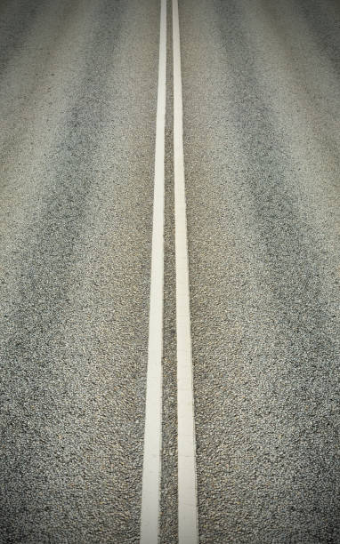istock Double white lines dividing the lanes 864435524