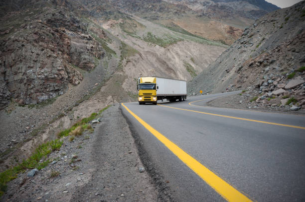 istock Heavy truck treep hill hairpin 864435558