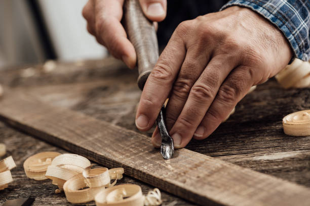 istock Carpenter carving wood 864435654