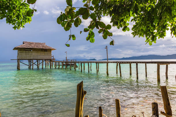 istock Bungalow on water. Raja Ampat, West Papua, Indonesia. 864435732