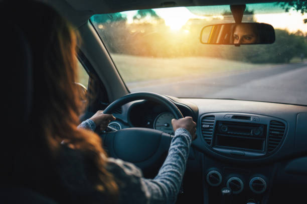 istock The girl drives her car. 864435906