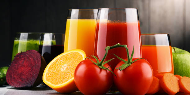 istock Glasses with fresh organic vegetable and fruit juices 864436490