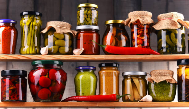 istock Jars with variety of pickled vegetables. 864437186
