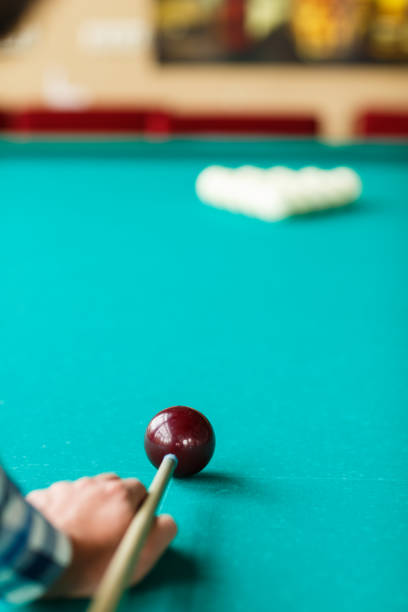 istock The player is going to break the pyramid with a red ball 864437534