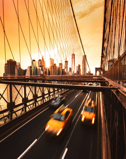 istock taxi running on brooklyn bridge 864437866