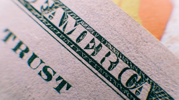istock a close-up part of a hundred dollars. 100 dollars in details, counterfeiting with dollar notes 864438430