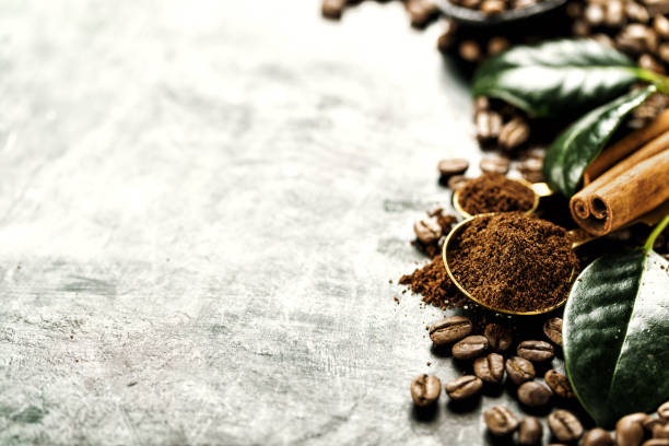 istock Closeup whole and grain roasted coffee seeds composition 864438492