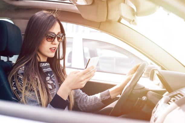 istock Beautiful young woman using mobile phone 864440040