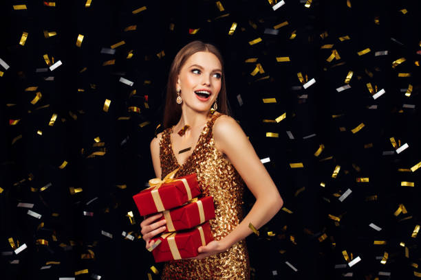 istock Laughing girl with falling confetti 864440418