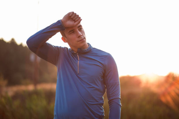 istock Tired Young Man Resting From Sports Activity 864445848
