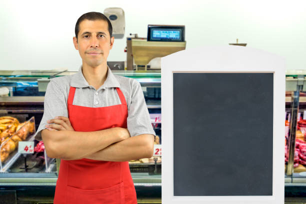 istock butcher standing arms crossed at butchery 864452102