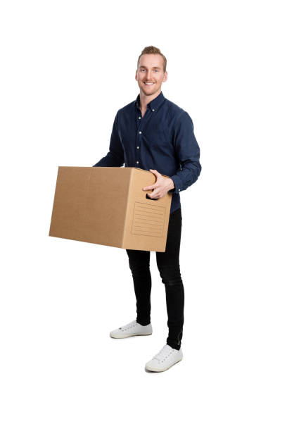 istock Good looking blonde man with a cardboard box 864452256
