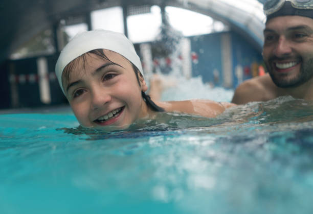 istock Happy boy in a swimming class 864453806