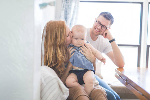 istock Mom and Dad Bonding with Baby 864454048