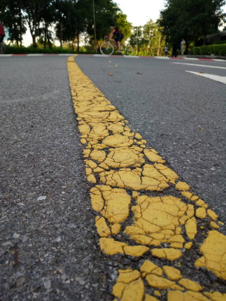 istock Yellow dividing line in the road 864456386