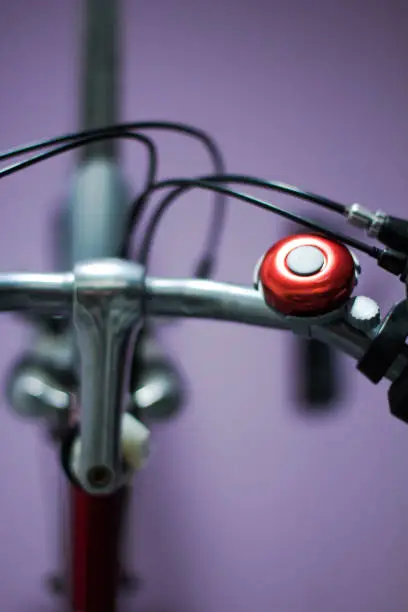 My red bike hanging on my purple wall with lots of bokeh