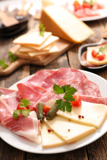 istock raclette cheese with potato and meats 864457436