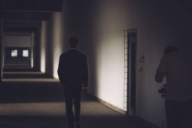 istock Gentleman in black suit walking 864468598