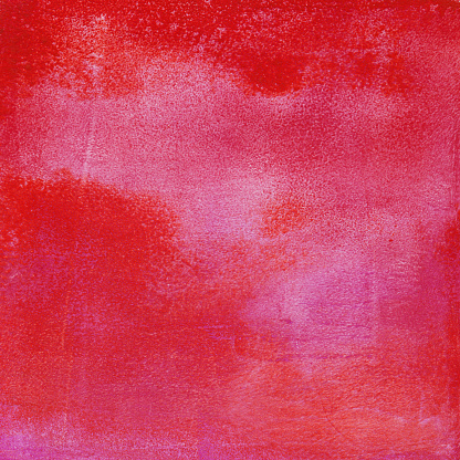 An hand painted acrylic background. There is a mottled texture and blending of colors. The prominent colors are shades of pink and red in a grungy texture.
