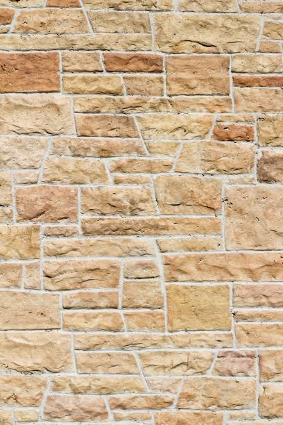 istock Pink and Orange Hue Aged Limestone Brick Wall Background 864470676
