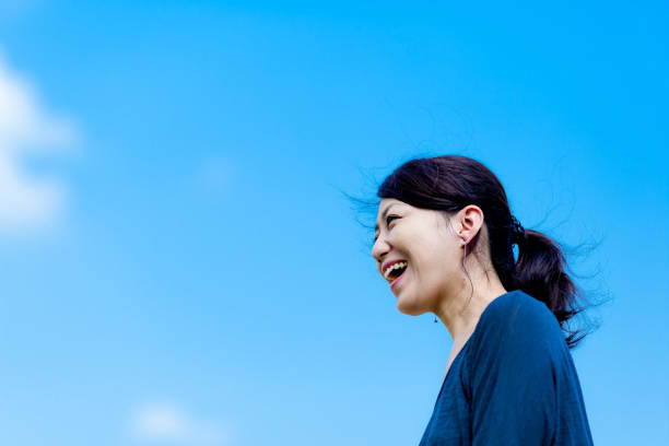 istock Blue sky and girls 864471236