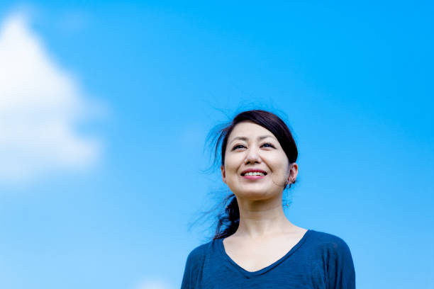 istock Blue sky and girls 864471354