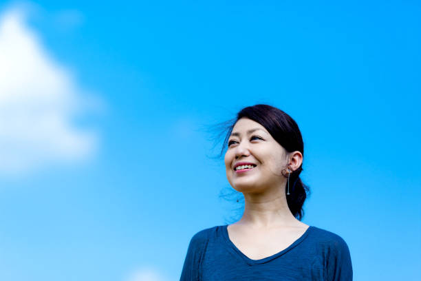 istock Blue sky and girls 864471378