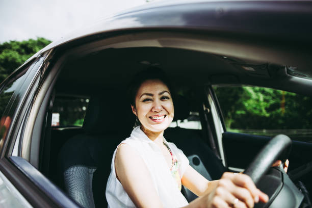 istock woman driving a car 864474944