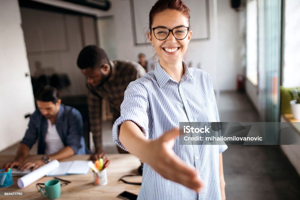 A handshake Young entrepreneur closing new business with a handshake Greeting Stock Photo