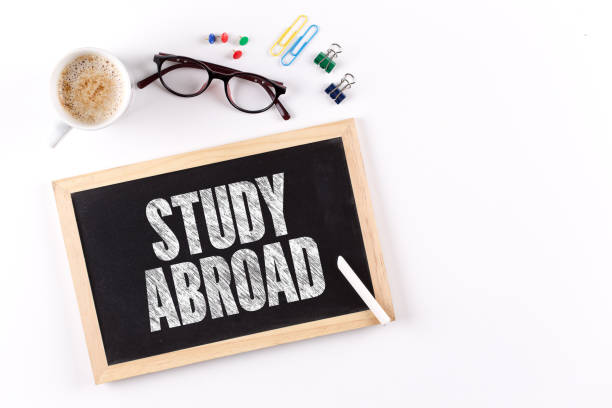 istock STUDY ABROAD word on Chalkboard with Coffee Cup, view from above 864486218