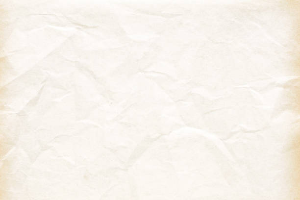 istock Old crumpled pale yellow texture 864487016