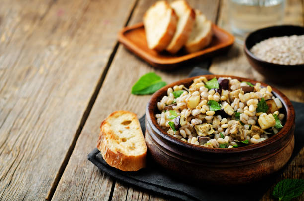 istock Roasted eggplant pine nuts mint barley salad 864487954