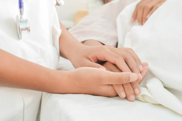 istock hospital patient hands to care 864488176