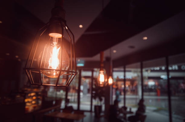 istock retro light bulb in coffee shop interior view 864488430