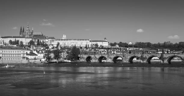 istock Panoramic view of Old Prague, monochrome 864489372