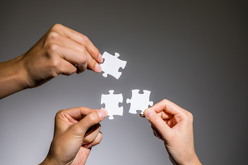 hands holding jigsaw puzzles, business to business, business matching concept