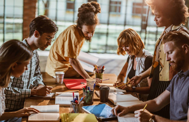 istock Large group of university students learning for their exams. 864490424
