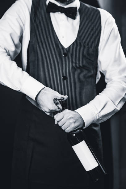 istock Sommelier opening wine bottle 864491358
