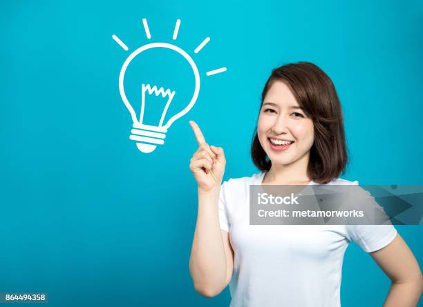 Inspired Woman Stock Photo - Download Image Now - Inspiration, Ideas, Women