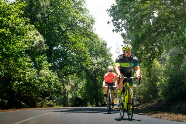 istock Determined young man cycling on country road 864494730