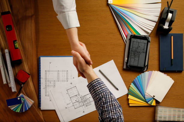 istock Architect and client Job agreed Engineer desk background Project ideas concept 864494908