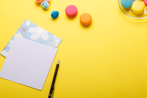 istock Social media flat lay with colorful macaroons, postcard and pen 864496448