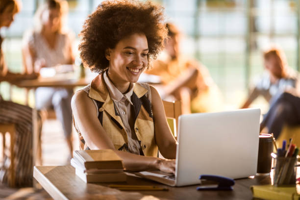 istock Happy African American student searching information for her exams over Internet. 864497376